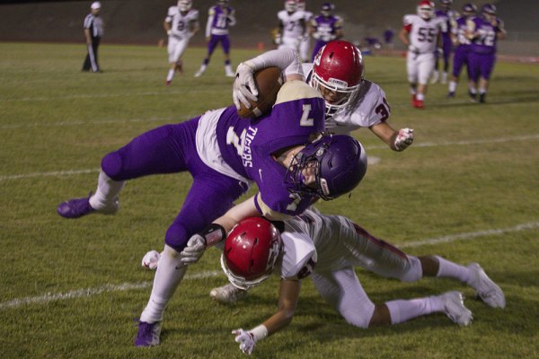 Lemoore's Will Schalde catches a pass from Justin Holaday for a first down against visiting Sanger Friday night.